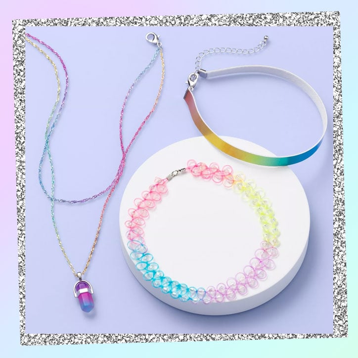 Two rainbow chokers and a crystal necklace with a long rainbow chain