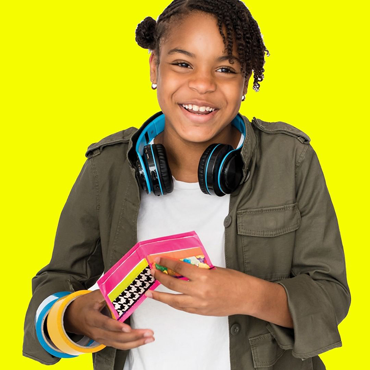 Teen girl holding a handmade duct tape wallet