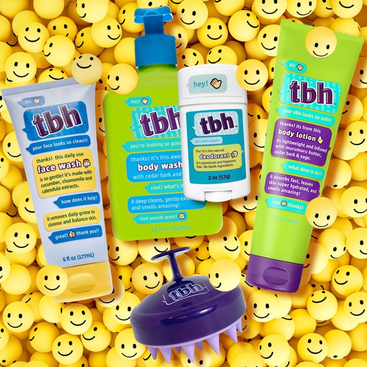 TBH Kids bath and body products laying on a bed of smiley face balls