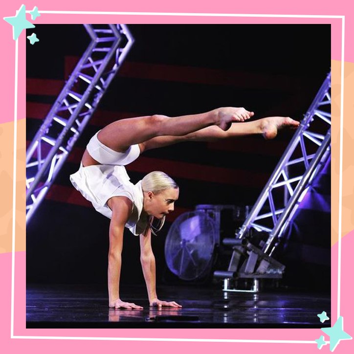 Dancer Katie Couch performing in a competition, balances on her arms while pointing her legs over her head