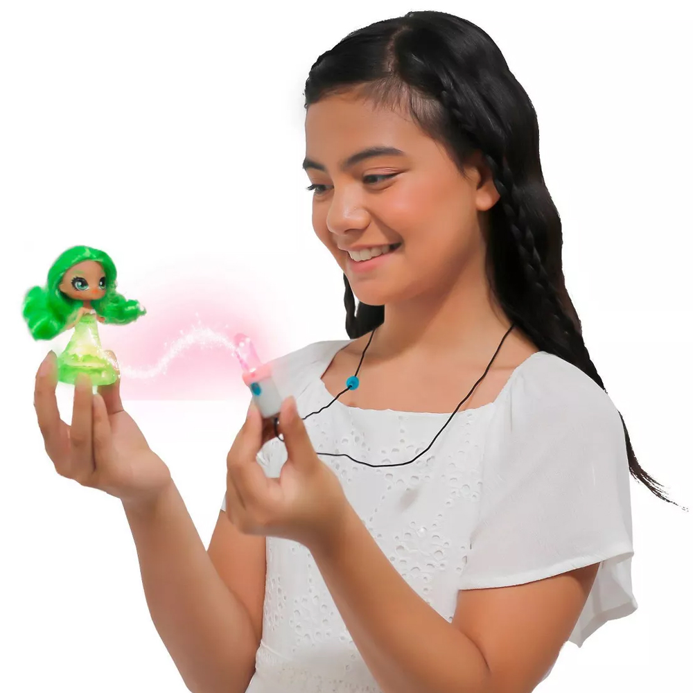 Tween girl holding a Crystalina doll showing off the crystal powers between the doll and the amulet
