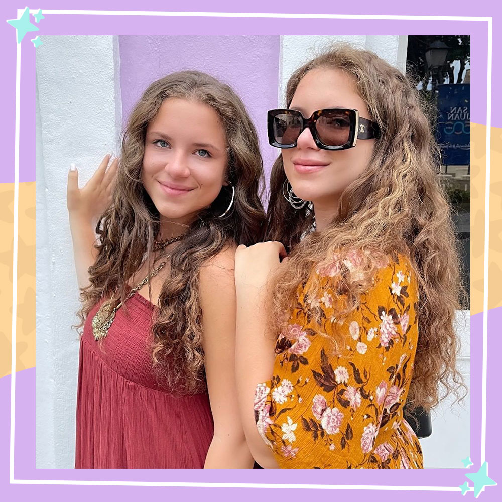 Bianca and Chiara D'Ambrosio pose in front of a wall in Puerto Rico