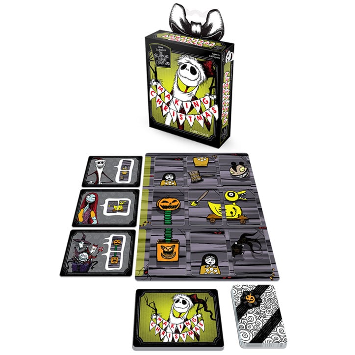Product shot of The Nightmare Before Christmas: Making Christmas card game including the box art, stack of toy parts cards, stack of goal cards, and 4 workbench tiles