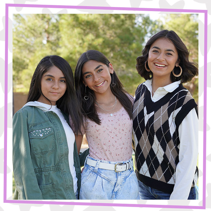 GEM Sisters Evangeline, Mercedes, and Giselle posing together outdoors in fall outfits