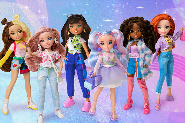 All six GLO-Up Girls dolls standing together in their glo-up outfits on a pretty swirly pink, blue, and purple ombre backdrop