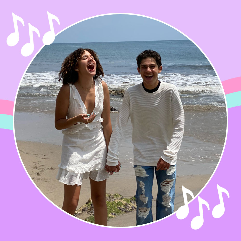 Jackson Dollinger and Scarlet Spencer laughing on the beach