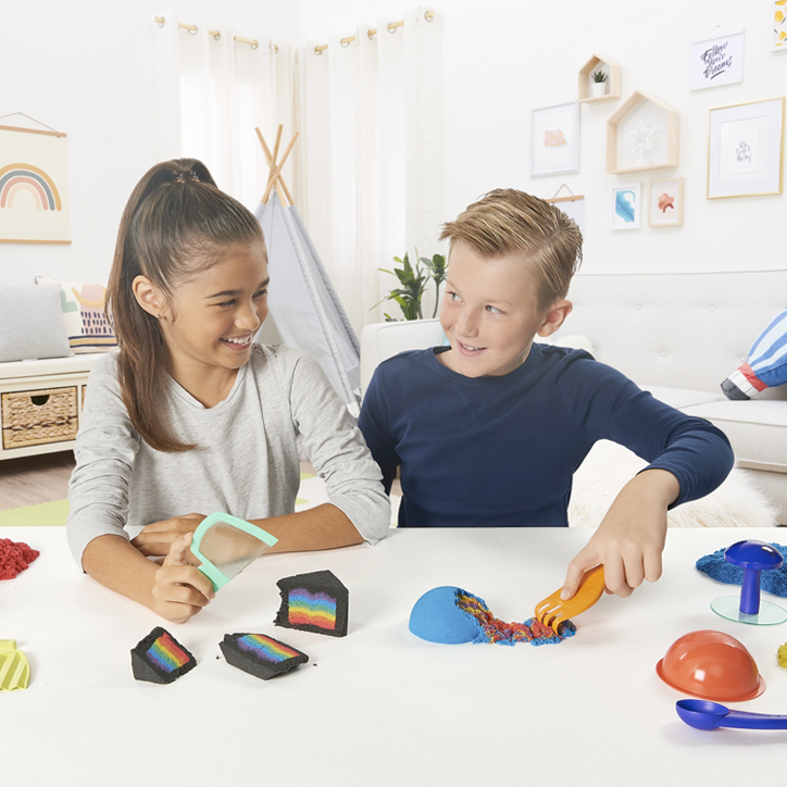 Lifestyle photo of two kids playing with the Kinetic Sand Sandisfactory Set