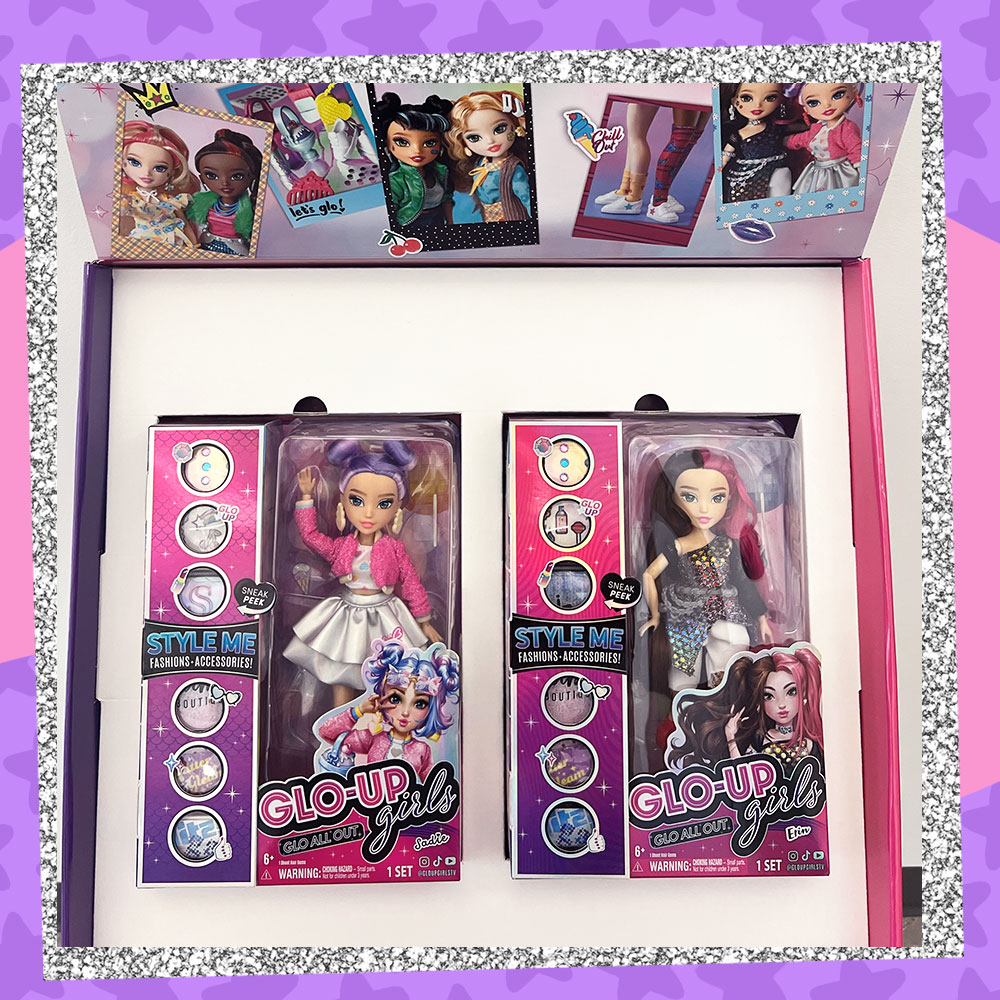 Photo of the inside of the exclusive Glo-Up Girls Deluxe Box that features two Glo-Up Girls Series 2 Dolls in their packaging.