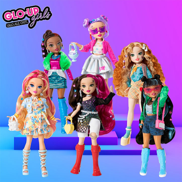 Product photo of the new Glo-Up Girls Series 2 Lineup with each of the 5 dolls fully styled and posed in front of an ombre blue and purple backdrop.