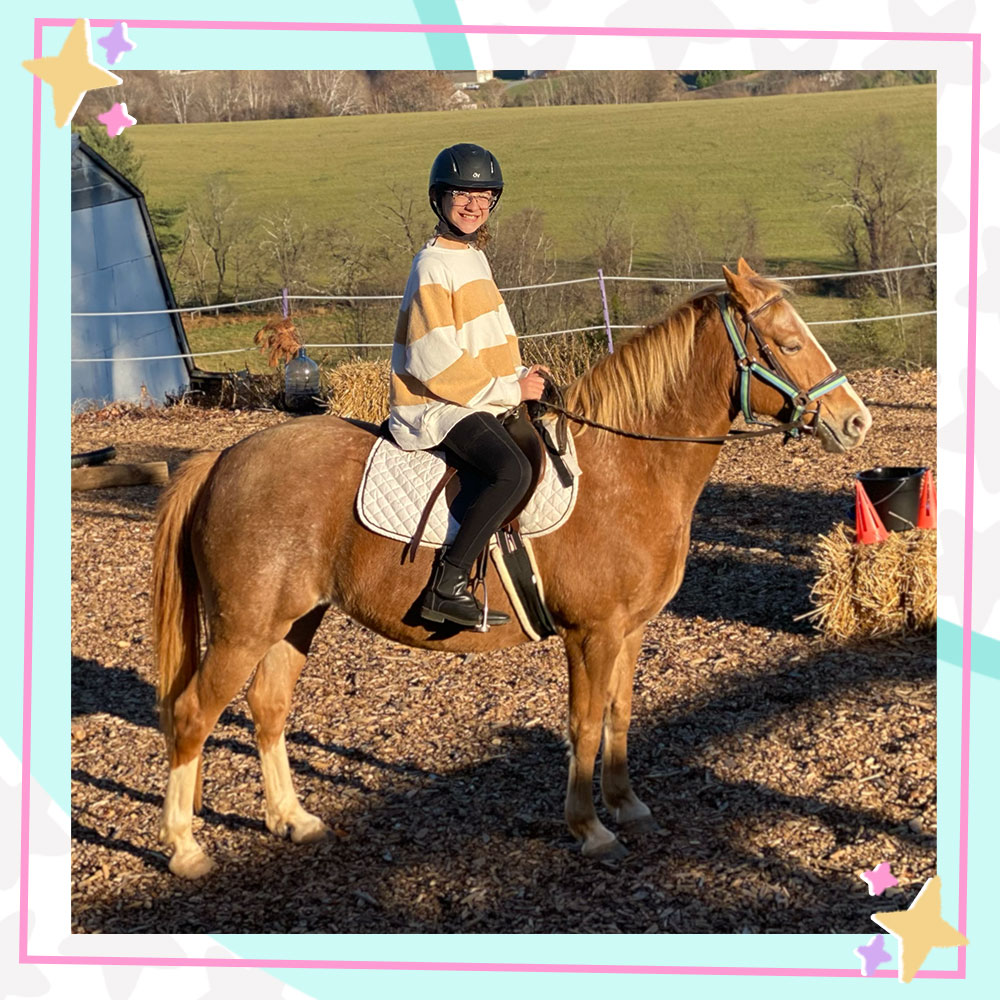 Savannah Dahan in riding gear sitting on a horse