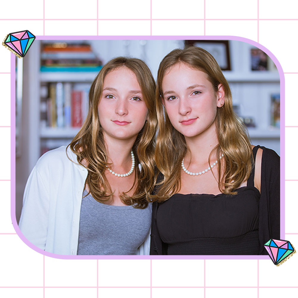 Sophie and Izzy, Founders of SOZY, standing in front of a bookcase