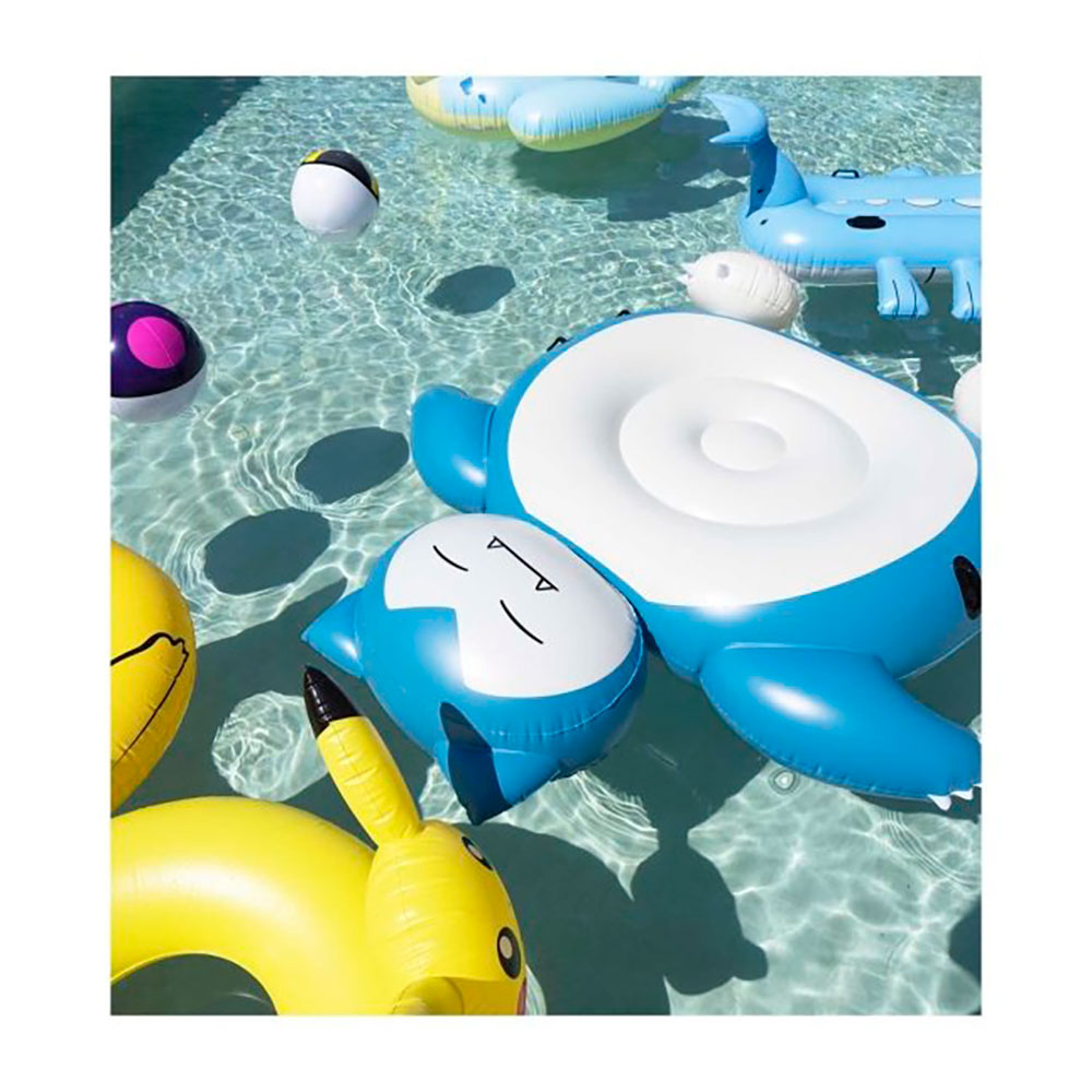 A pool filled with Pokémon Pool floats including Snorlax, Pikachu, Lapras, Wailord and Pokéball shaped beach balls