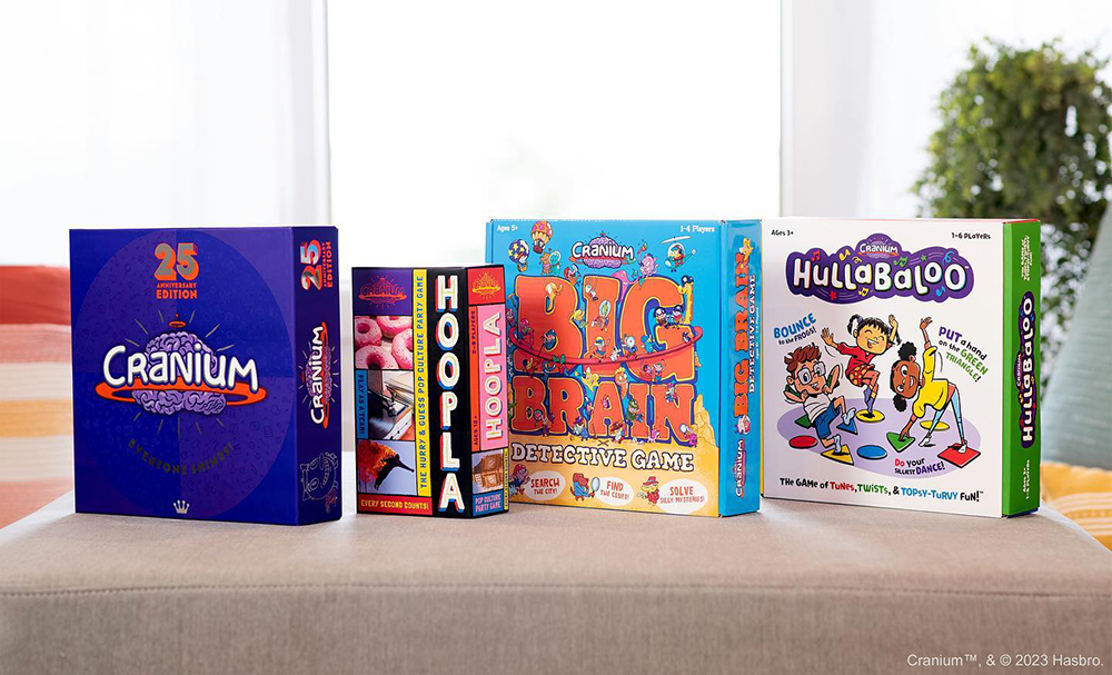 Cranium 25th Annivesary Edition, Hoopla, Big Brain Detective Game, and Hullaballoo game boxes lined up on a table