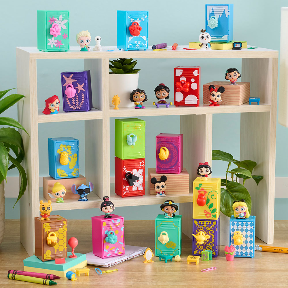 The Disney Doorables Academy Surprise Lockers collection sitting on a shelf surrounded by school supplies. Each character is sitting next to their themed locker.