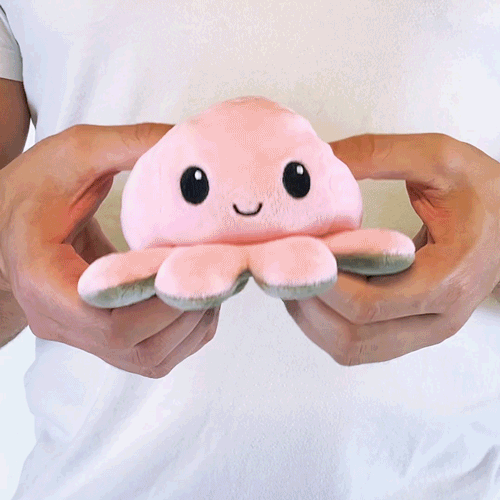 Animated GIF of a person showing off how to flip and reverse a TeeTurtle reversible plush