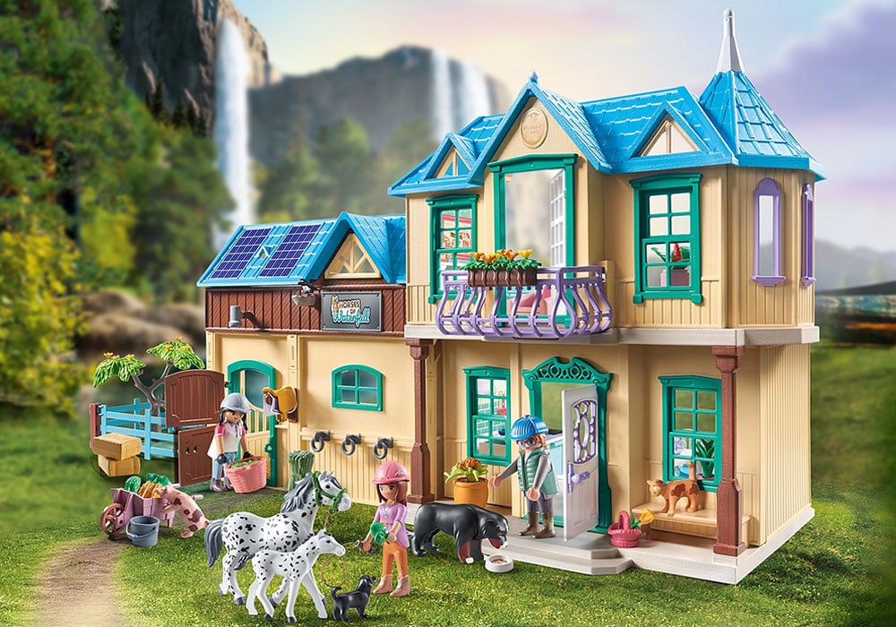 Fully assembled Waterfall Ranch set featuring the cozy home, character figures, horses, and stable