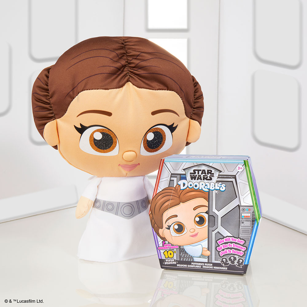 A Princess Lei Star Wars Doorables Puffables standing next to the product box